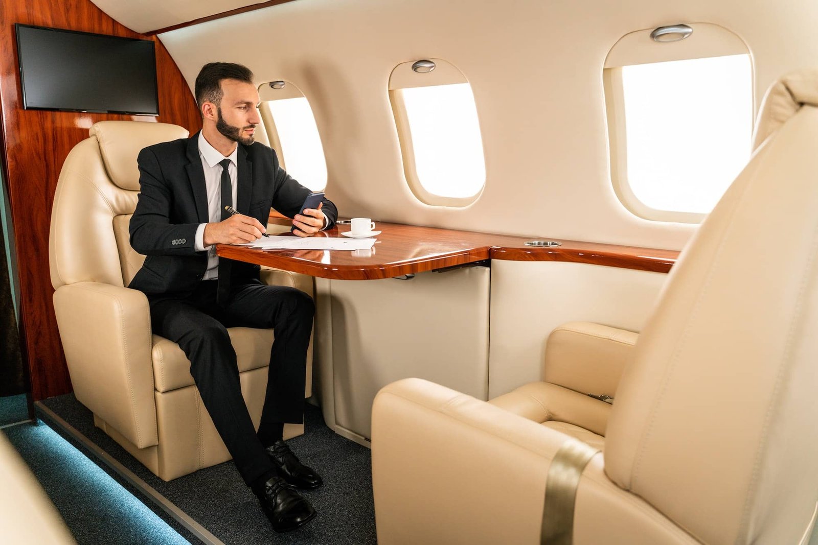 Businessman flying on private jet