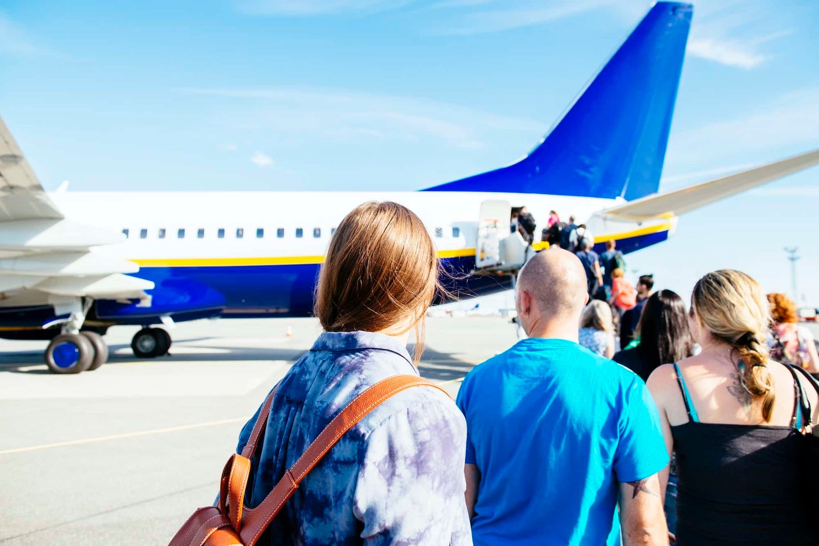 Rear view of people waiting for a private jet