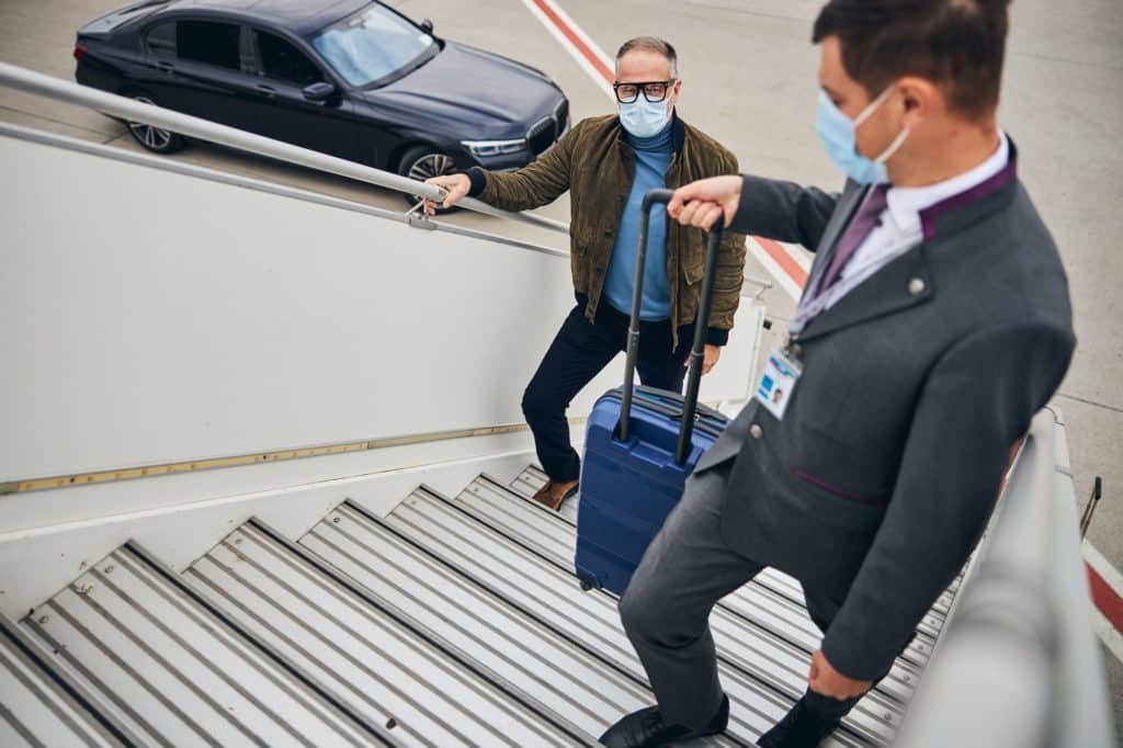 Man in casual clothes boarding the plane