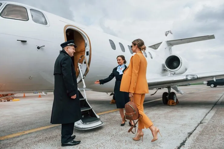 woman-walking-with-dog-boarding-private-jet-with-pilot