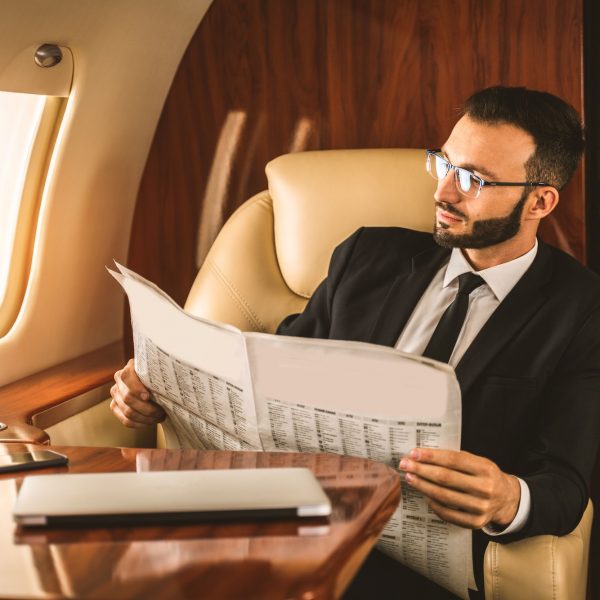 Businessman flying on private jet