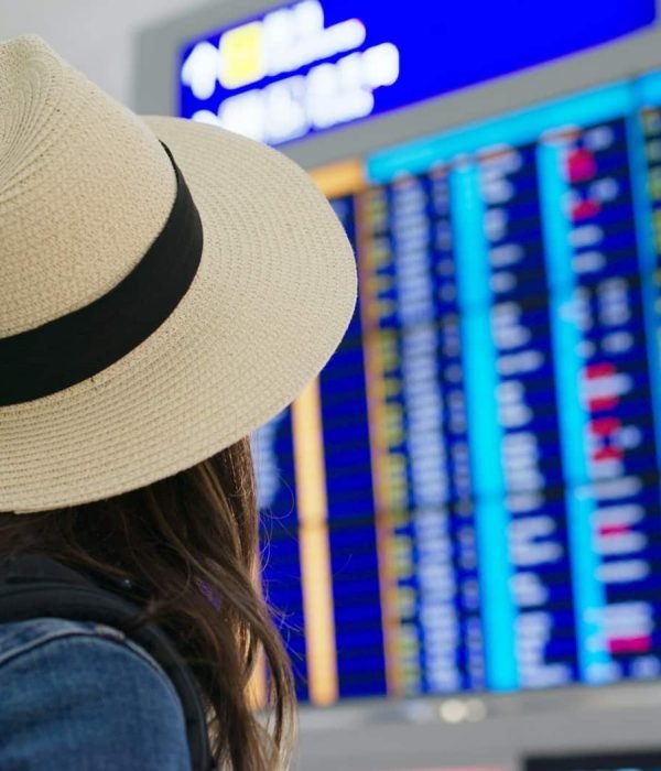 Woman look the flight schedule in the airport